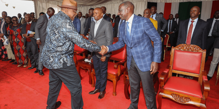 President William Ruto shakes hands with Former President Uhuru Kenyatta during the consecration of Bishop Peter Kimani in Embu. PHOTO/Office of the 4th President.