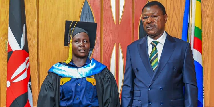 Graduate Claire Juma and the Speaker of the National Assembly Moses Wetangula,