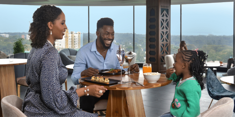 A family enjoying a moment at the Novotel Hotel in Nairobi.