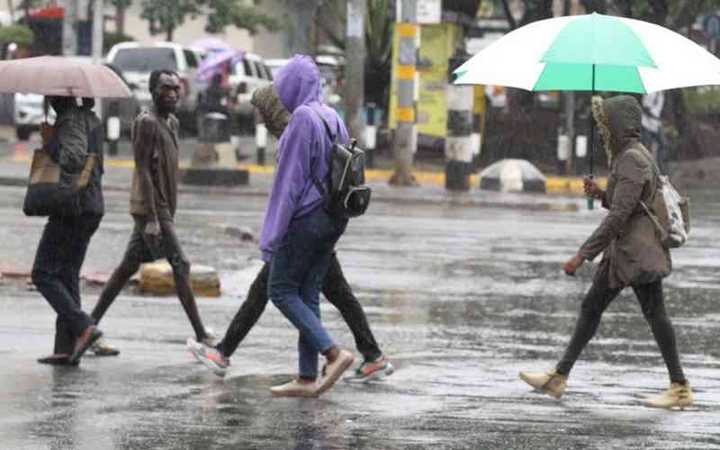 Nairobians use umbrellas to work after short morning rains in the City on March 16th,2023. PHOTO/ Elvis Ogina, Standard.Nairobians use umbrellas to work after short morning rains in the City on March 16th,2023. PHOTO/ Elvis Ogina, Standard. Weather, Weather. Rainfall