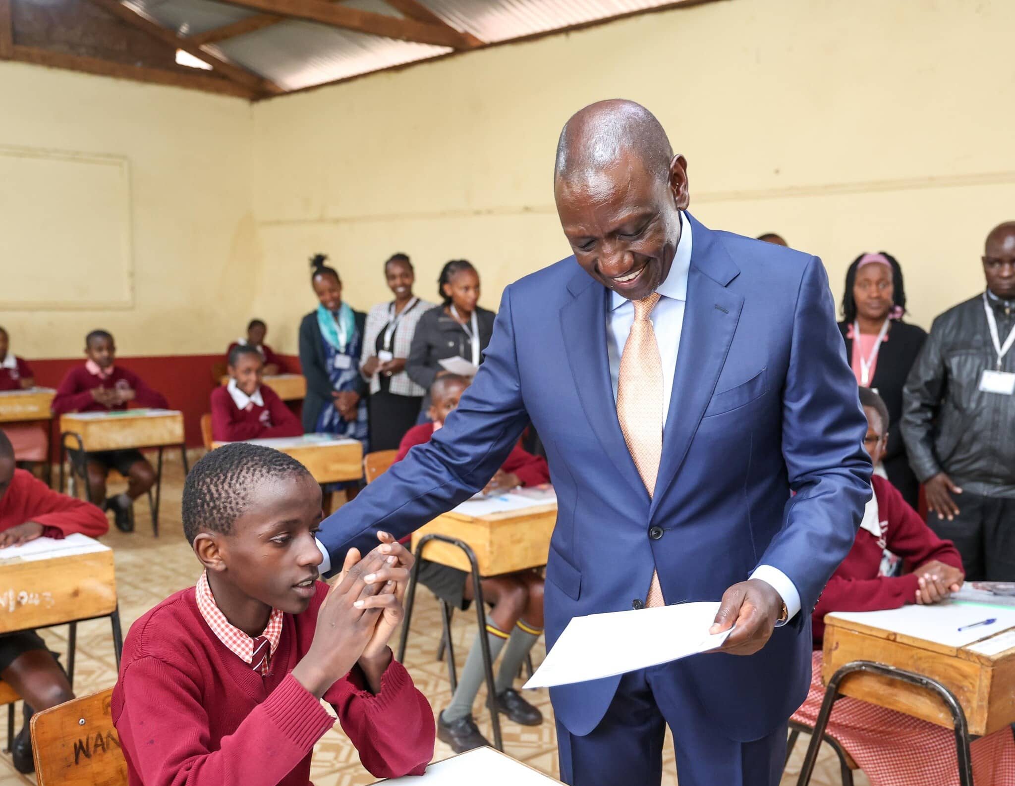 Kenya’s President William Ruto administering exam papers during a past national test. PHOTO/PCS.