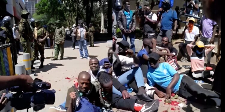 Police with Protestors in Nairobi CBD on Monday, December 30.
