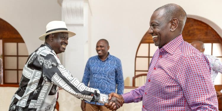 President William Ruto shakes hands with Former Prime Minister Raila Odinga.