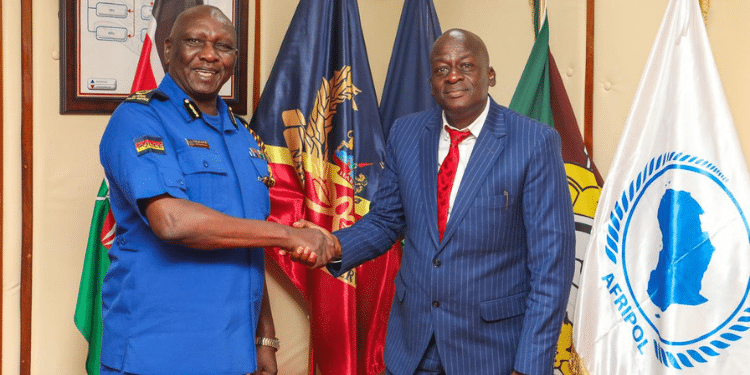 Police IG Douglas Kanja shakes hands with Kenya National Police DT SACCO CEO Solomon Atsiaya. PHOTO/ Kenya National Police DT SACCO.