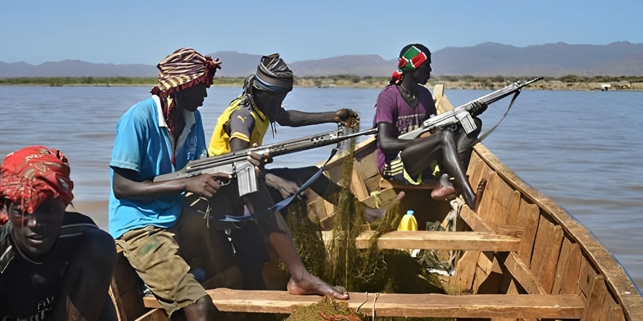 Turkana fishermen holding guns in a boat