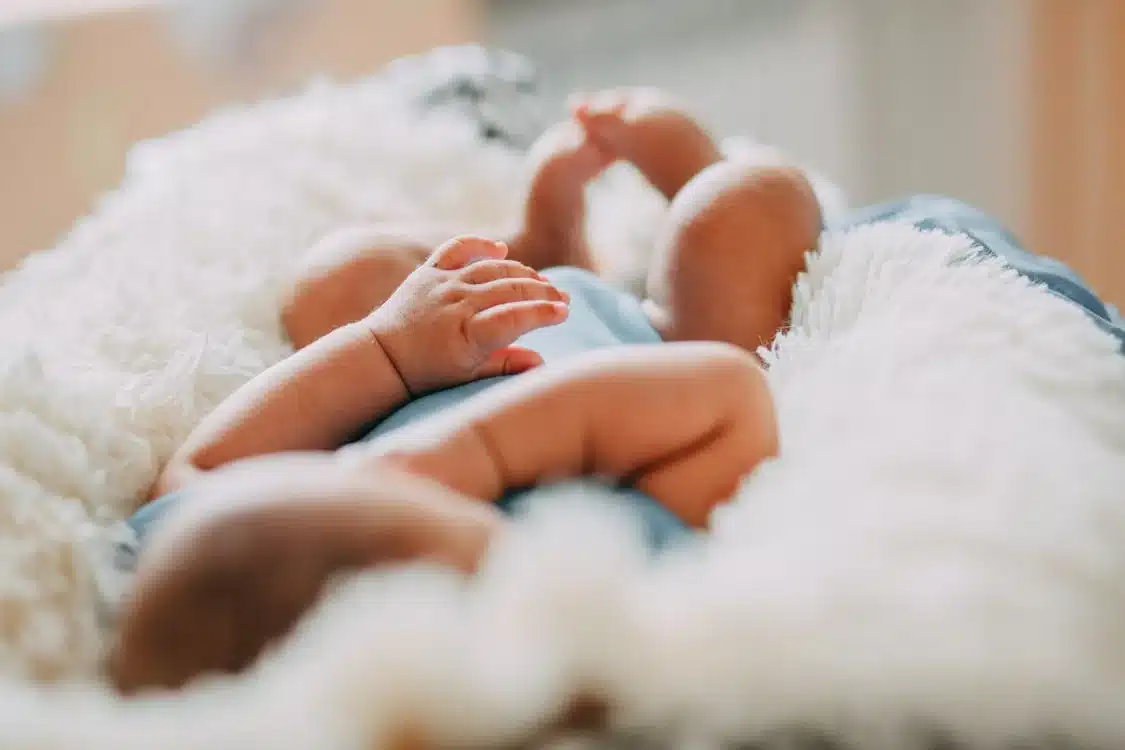 Photo Of Baby Laying On Fleece Blanket. Photo/ Pexels