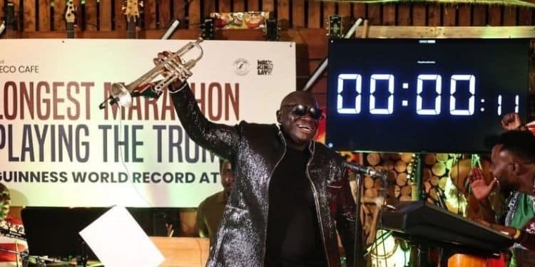 Kenyan trumpeter Mackinlay Mutsembi breaking the Guinness World Record for the longest marathon playing the trumpet.