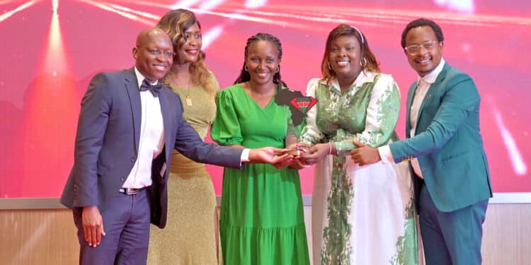 SGA Kenya Head of Finance Justus Kenyoru, Sales and Marketing Manager Irene Opondo, SGA Group PR and Communications Manager (2nd right) and SGA Kenya Customer Service Manager Peter Kinyanjui (R) receive the Most Professional and Well-trained Security Company in Kenya Award at the Consumer Choice Awards Kenya.