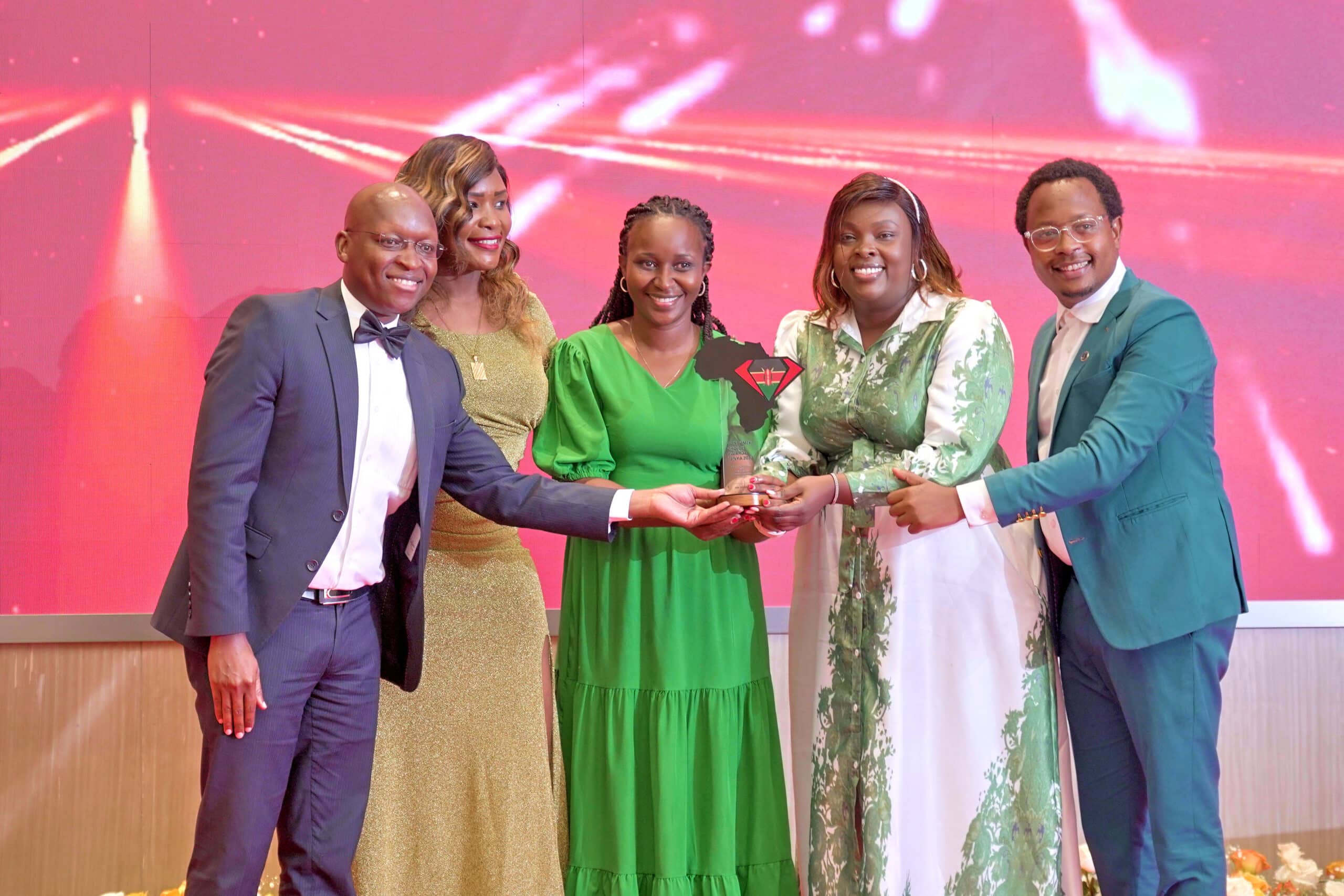 SGA Kenya Head of Finance Justus Kenyoru, Sales and Marketing Manager Irene Opondo, SGA Group PR and Communications Manager (2nd right) and SGA Kenya Customer Service Manager Peter Kinyanjui (R) receive the Most Professional and Well-trained Security Company in Kenya Award at the Consumer Choice Awards Kenya.