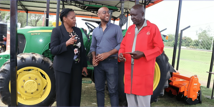 Absa Bank Kenya Business Banking Director Elizabeth Wasunna operates a tractor during the launch of Hello Tractor’s new mechanism hub in Kisumu County. She was joined by Kisumu County Government County Executive Committee Member Ministry of Agriculture Kenneth Onyango, Hello Tractor CEO Jehiel Oliver and Kisumu County Government Chief Officer Agriculture Daniel Okia. Photo/ File