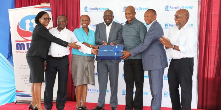 Chief of the Defence Forces General Charles Kahariri (3R), Family Bank Chair Lazarus Muema (2R), The Family Group Foundation Chairman Dr. Francis Muraya (C) during the graduation of 100 dependents of Kenya Navy service men and women