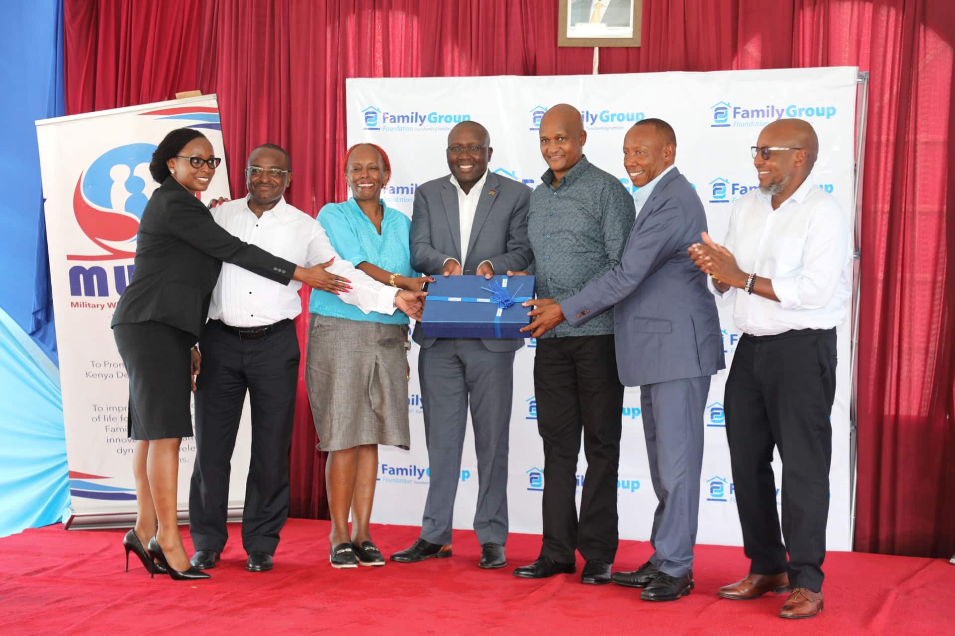 Chief of the Defence Forces General Charles Kahariri (3R), Family Bank Chair Lazarus Muema (2R), The Family Group Foundation Chairman Dr. Francis Muraya (C) during the graduation of 100 dependents of Kenya Navy service men and women