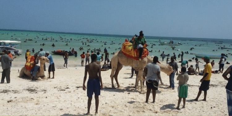 Visitors enjoying the sunny shores of the public beach at Diani Resort PHOTO/Diani Resort