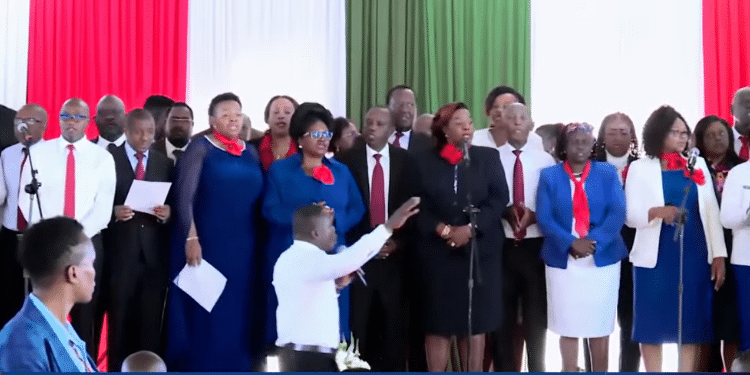 South Mugirango MP Silvanus Osoro leading a joint choir consisting of leaders from Kenya and Tanzania during the National Breakfast Day. PHOTO/Screenshot State House.