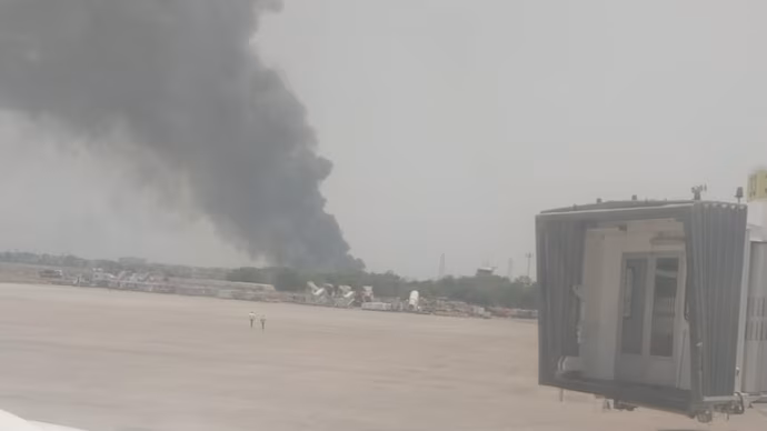 Smoke fills the air after the plane crashed near Ahmedabad airport. Photo/ India Today Air India