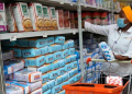 A Lady Picks Wheat Flour At Naivas Supermarket In Nyeri On June 9, 2021. Photo/Nmg