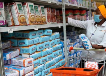 A Lady Picks Wheat Flour At Naivas Supermarket In Nyeri On June 9, 2021. Photo/Nmg