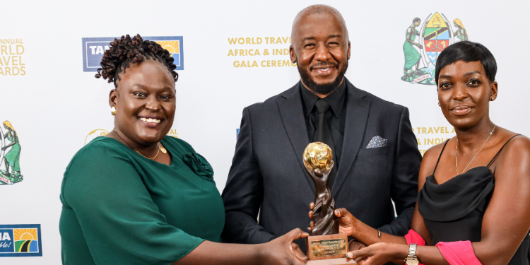 Charlie Owino (C), Director Ground Operations, Jambojet, is all smiles with Maureen Omollo- Sales & Operations Manager, Zanzibar (L), and Camilla Owora (R) Marketing & Communication Manager at the gala Ceremony in Dar es Salaam over the weekend.