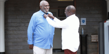 President WIlliam Ruto makes the collar of East African Court of Justice judge Charles Nyachae. Photo/DPP