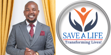 Founder And President Of Save A Life Community Dr. Joseph Murimi With The Community’s Logo. Photo/Save A Life Community.