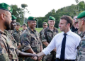 French President Emmanuel Macron meets with members of the 3rd Foreign Infantry Regiment of the French Foreign Legion at the Advanced Operational Base in Camopi, as part of a two-day visit to the French overseas department of Guiana, South America, on March 25.