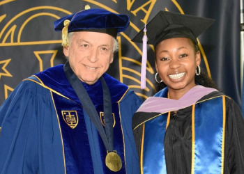 Lisa Bukhala (right) receiving the Leon Battista Alberti Award by the University of Notre Dame. PHOTO/KU