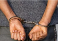 A Suspect Arrested And Put In Handcuffs. Photo/Nation.
