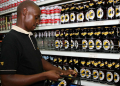 A Shopper Buys Alcohol At A Supermarket.