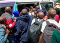 Students Scrambling For A Matatu.