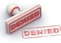 A Graphic Representation Of The Denied Stamp On Document.