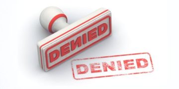 A Graphic Representation Of The Denied Stamp On Document.