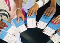 A Photo Of Kenyans Holding Passports.