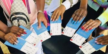 A Photo Of Kenyans Holding Passports.