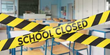 A Yellow Tape With School Closed Warning.