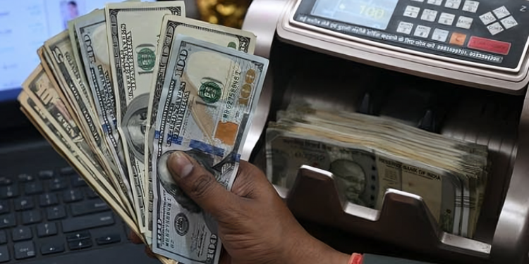 Is This The End Of Us Dollar Dominance? China, India Take Steps To Trade In Their Own Currencies A Cashier At A Bank Handling Dollar Notes Photo/Marketplace