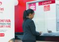 A Customer Being Attended To At An Airtel Shop.
