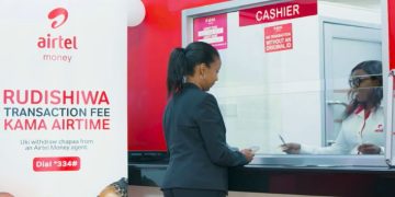 A Customer Being Attended To At An Airtel Shop.