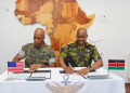 General Charles Kahariri And Us General Michael Langley Signing The Joint Communiqué From The African Chiefs Of Defence Conference (Achod) In 2025 Photo/Kdf