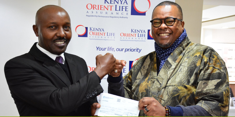 Kenya Orient Life Assurance Company: History, Branches, Premiums And Packages Offered General Manager Jackson Muli Presenting A Cheque To The Rotary District 9212 Governor Alex Nyaga Photo/ Kenya Orient Life Assurance Limited