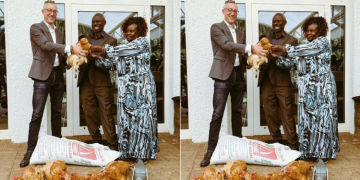 A Photo Of Kenyan Gardener Bwana Hesbon Imbwaka And German Ambassador To Kenya, Sebastian Groth Holding Chicken. Photo/ Sebastian Groth