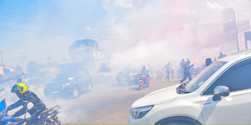 People Fleeing The Scene As Tear Gas Fills The Air Photo/Methu