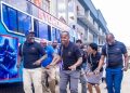 Members Of Nyoroma Self Help Group And Some Of Their Families Led By Their Chairman, Alex Muthama Break Into Song And Dance During The Handover Ceremony Of Their Bus Outside Equity Bank Kenya Rongai Branch.