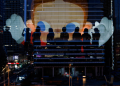 The Reflection Of Silhouettes Of People Is Visible On A Glass On A Terrace Of A Shopping Mall Overlooking Beijing'S Central Business District (Cbd), China , August 11, 2025. Reuters/Tingshu Wang