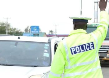 Traffic Police Officer Stops Motorists On Highway.