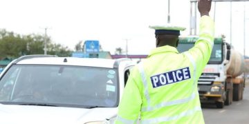 Traffic Police Officer Stops Motorists On Highway.