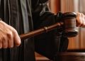 A Judge Holding A Gavel.