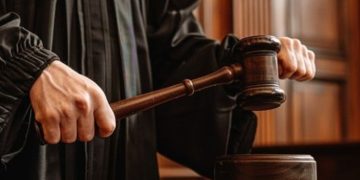 A Judge Holding A Gavel.