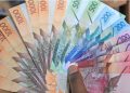 A Photo Of Someone Holding Kenyan Bank Notes