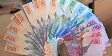 A Photo Of Someone Holding Kenyan Bank Notes