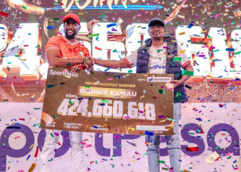 Sportpesa Ceo Ronald Karauri (Left) Hands Over A Cheque To Mega Jackpot Winner Bonnie Kamau On August 13, 2025.